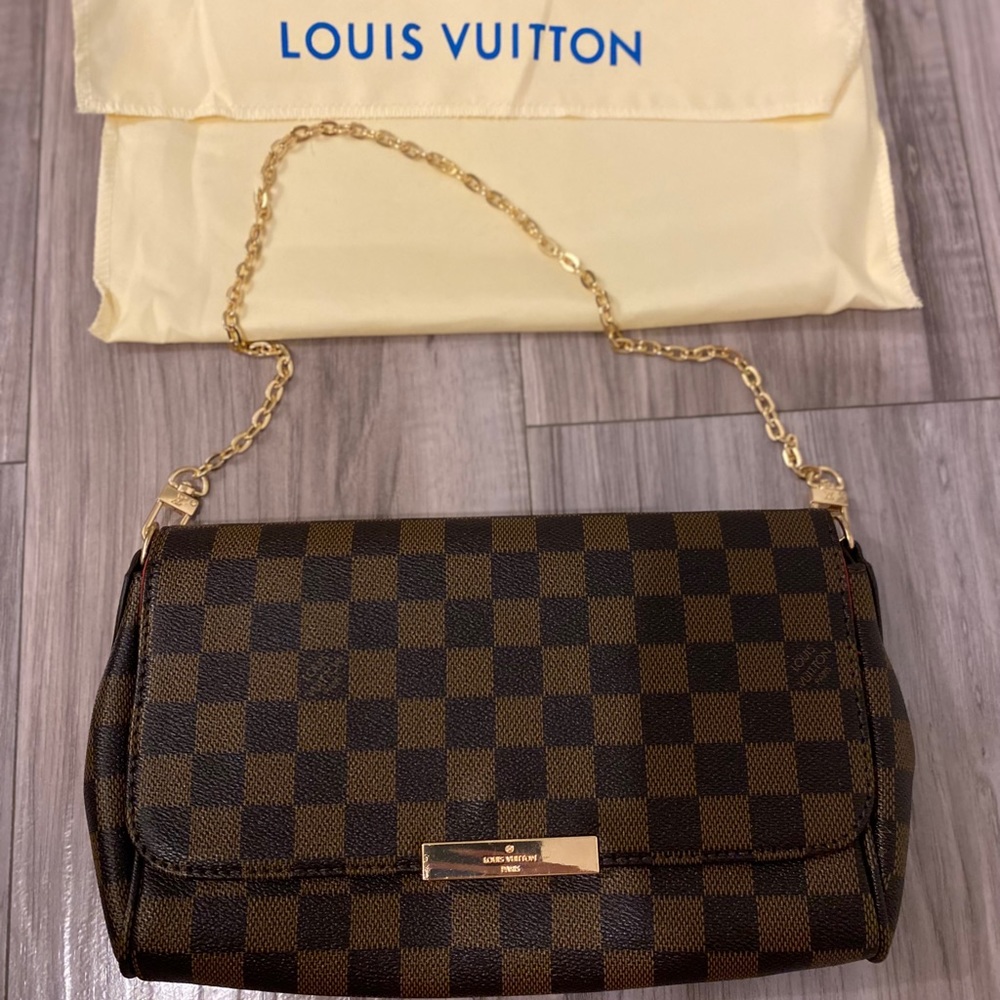 Brand new checkered pochette bag